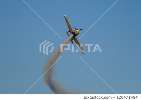 Stunt aerobatic plane performing stunts in air 120471484