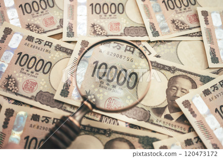 Money and magnifying glass Money and magnifying glass 120473172