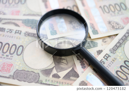 Money and magnifying glass Money and magnifying glass 120473182
