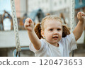 A Playful Child Happily Enjoying Various Outdoor 120473653