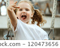 A Playful Child Happily Enjoying Various Outdoor 120473656