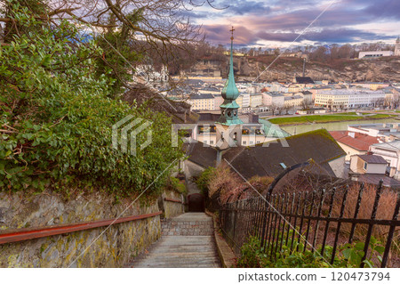 Steps of an old staircase and a church spire in Salzburg, Austria Steps of an old staircase and a church spire in Salzburg, Austria 120473794