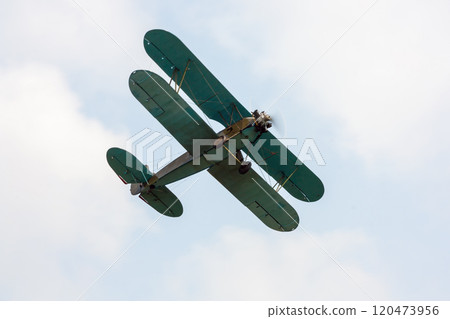 Retro airplane is flying 120473956