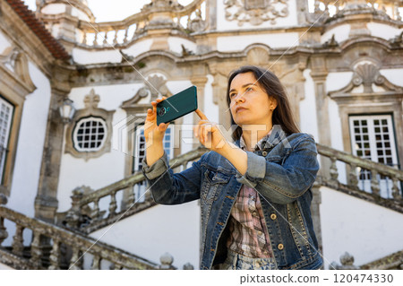 Woman tourist with phone, Vila Real, Portugal 120474330