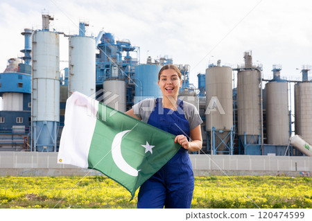 Cheerful young woman holds the national flag of Pakistan Cheerful young woman holds the national flag of Pakistan 120474599