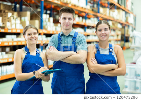 Portrait of three construction supermarket workers in overalls 120475296