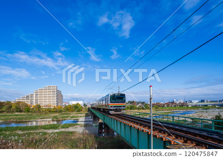 Hachiko Line train running over Asakawa Railway Bridge 120475847