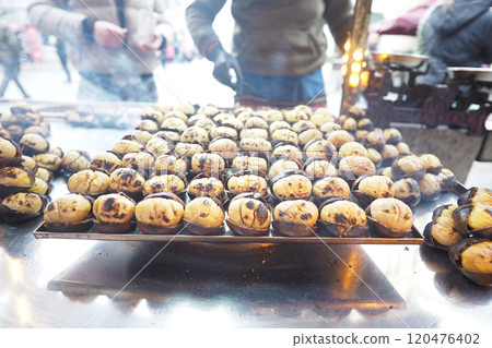 traditional Istanbul street food grilled chestnuts in a row traditional Istanbul street food grilled chestnuts in a row 120476402