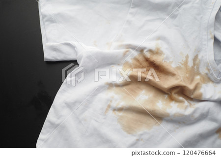spilled coffee on a white shirt spilled coffee on a white shirt 120476664
