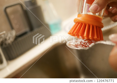 Washing Kitchen Utensils Effectively Using a Brush and Soft Dish Soap for Optimal Clean Washing Kitchen Utensils Effectively Using a Brush and Soft Dish Soap for Optimal Clean 120476771