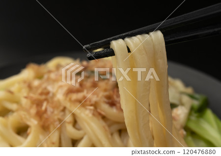 I can pick up the steaming hot yakisoba noodles with my chopsticks. I can pick up the steaming hot yakisoba noodles with my chopsticks. 120476880