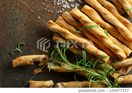 Homemade grissini breadsticks with sea salt and rosemary. 120477157