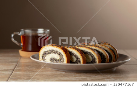 Poppy seed roll slices on a plate. Poppy seed roll slices on a plate. 120477167