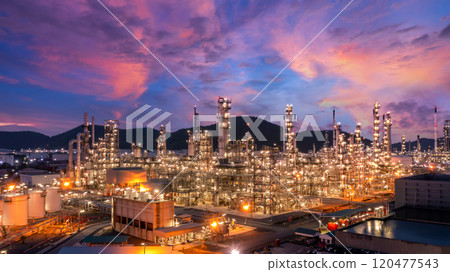 Oil and gas refinery industrial storage tank with oil and gas refinery plant at night, Refinery oil and gas power energy industrial, Oil and gas refinery petrochemical product plant pipeline steel. 120477543