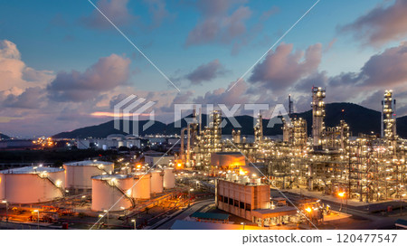 Oil and gas refinery industrial storage tank with oil and gas refinery plant at night, Refinery oil and gas power energy industrial, Oil and gas refinery petrochemical product plant pipeline steel. 120477547