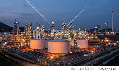 Oil and gas refinery industrial storage tank with oil and gas refinery plant at night, Refinery oil and gas power energy industrial, Oil and gas refinery petrochemical product plant pipeline steel. Oil and gas refinery industrial storage tank with oil and gas refinery plant at night, Refinery oil and gas power energy industrial, Oil and gas refinery petrochemical product plant pipeline steel. 120477548