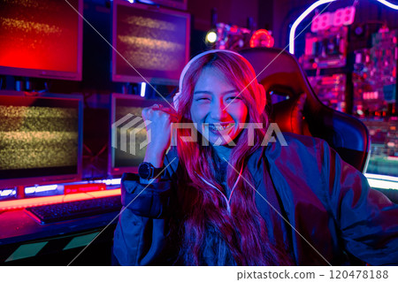 Winning. Happy Gamer young plays online video games computer she raises hands to wins tournament, young woman playing video game online at home feel excited, Hacker hacking complete 120478188