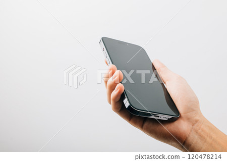 Man hand holding black smartphone mockup blank screen display, A hand holding a black cell phone isolated on white background, web site design application 120478214