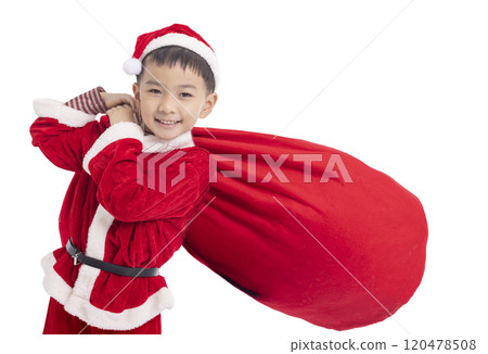 Happy child Dressed as Santa Carrying Bag Full of Gifts Happy child Dressed as Santa Carrying Bag Full of Gifts 120478508