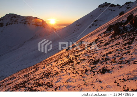 Breathtaking Rocky Mountain Slope Bathed in Morning Sunlight with Snow-Capped Peaks Nearby Breathtaking Rocky Mountain Slope Bathed in Morning Sunlight with Snow-Capped Peaks Nearby 120478699