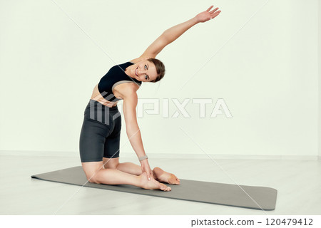 Yoga Side Stretch Pose on the flor 120479412