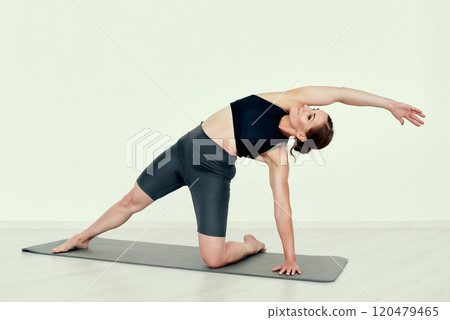 Dynamic Side Stretch on the flor Dynamic Side Stretch on the flor 120479465