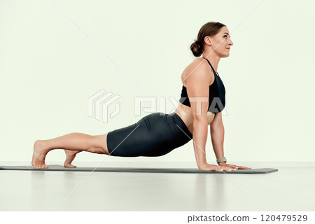 Fit Female in Upward Dog Position 120479529