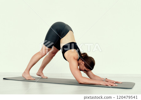 Woman in Downward Dog Pose 120479541