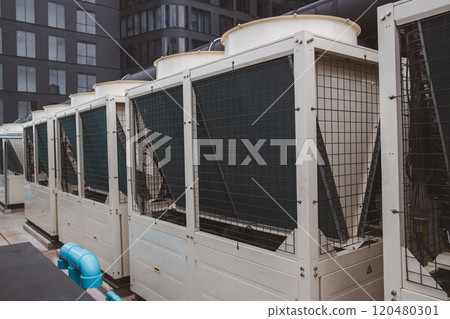 Air conditioner compressor installed in old building. Outdoor split wall type air conditioner compressor unit inverter installed on the outside of the building. Air conditioner compressor outdoor unit 120480301