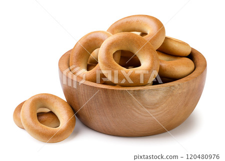 Drying bagels in a wooden plate on a white background. Isolated Drying bagels in a wooden plate on a white background. Isolated 120480976