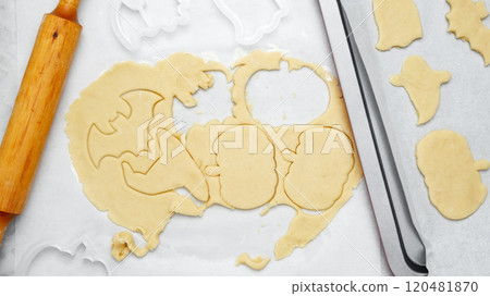 Dough with cookie cutter. Making different shapes of fall cookies for Halloween 120481870