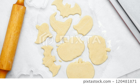 Dough with cookie cutter. Making different shapes of fall cookies for Halloween. 120481871