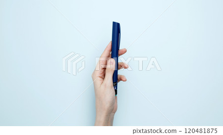 Woman hands holding syringe pen with insulin. Concept of worldwide diabetes awareness 120481875
