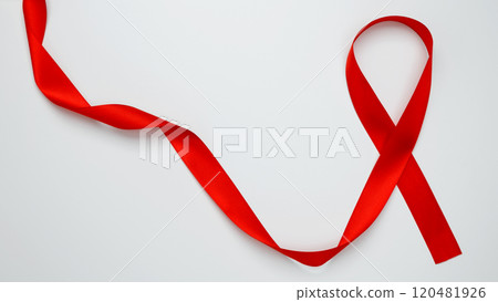 World AIDS Day. Red ribbon with awareness about AIDS on a white background World AIDS Day. Red ribbon with awareness about AIDS on a white background 120481926