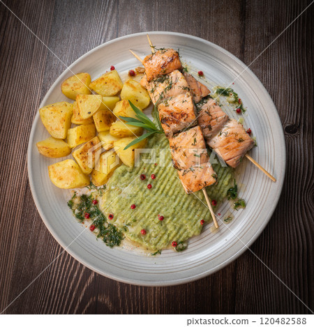 Barbecued salmon skewer with potatoes and broccoli Puree 120482588