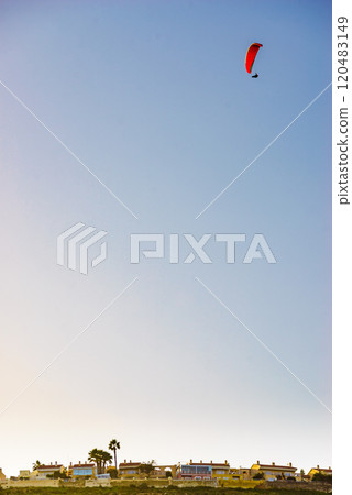 Paraglider flying in sky. Paraglider flying in sky. 120483149