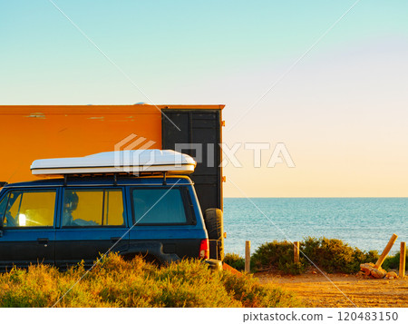 Camper van with closed tent on roof top 120483150