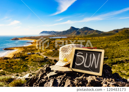 Black board with word sun against sea coast 120483173