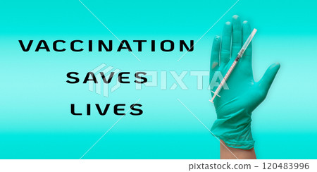 Hand holding a syringe with the words Vaccination saves lives Hand holding a syringe with the words Vaccination saves lives 120483996