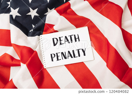 Red and white American flag with a white sign that says Death Penalty Red and white American flag with a white sign that says Death Penalty 120484082