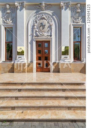 Entrance of Azerbaijan State Puppet Theatre in Baku is a beautiful building with a white facade and ornate details 120484125