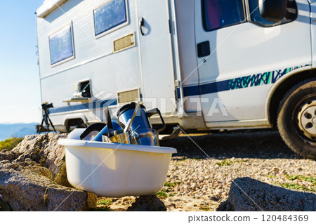 washing dishes in bowl, capming outdoor 120484369