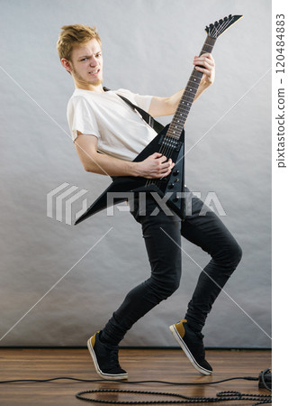 Man playing on electric guitar Man playing on electric guitar 120484883