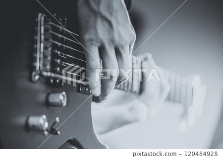 Close up of man playing on electric guitar 120484928
