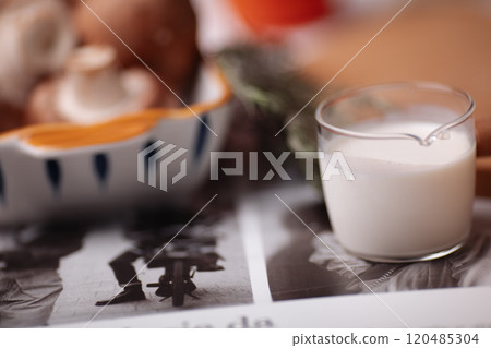 A woman is going to cook, food is on the table A woman is going to cook, food is on the table 120485304