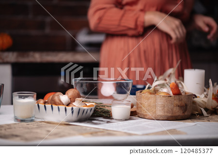 kitchen, a woman cooks, food and plates on the 120485377