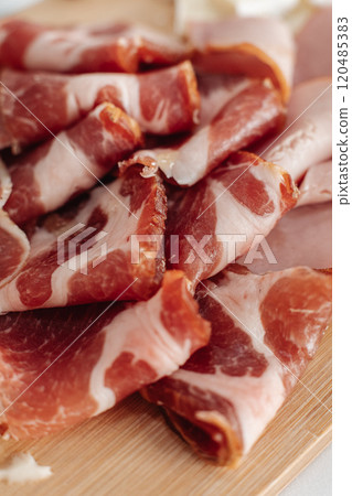 dried meat sliced on the table dried meat sliced on the table 120485383