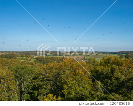 Schwaebische Alb, Germany - October 1st 2023: View from the famous Roemerstein viewpoint over hills and forests 120485616