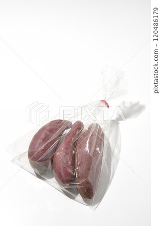 Bagged sweet potatoes photographed on a white background 120486179