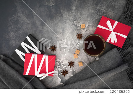 Christmas composition with a cup of coffee, candy, sugar and gift box on dark background. Flat lay, top view Christmas composition with a cup of coffee, candy, sugar and gift box on dark background. Flat lay, top view 120486265